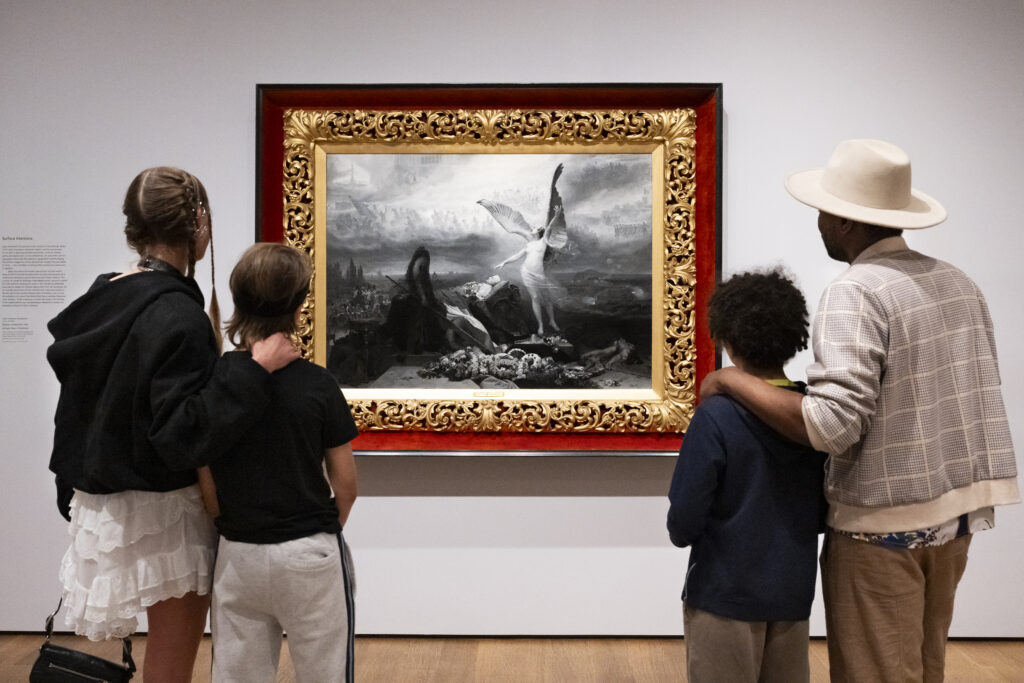 People staring at a painting