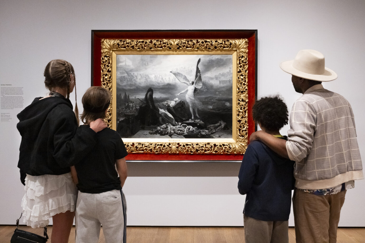 People staring at a painting