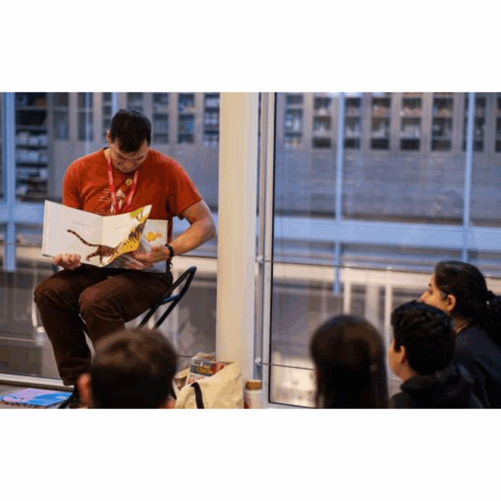 A librarian reading a children's book to kids.