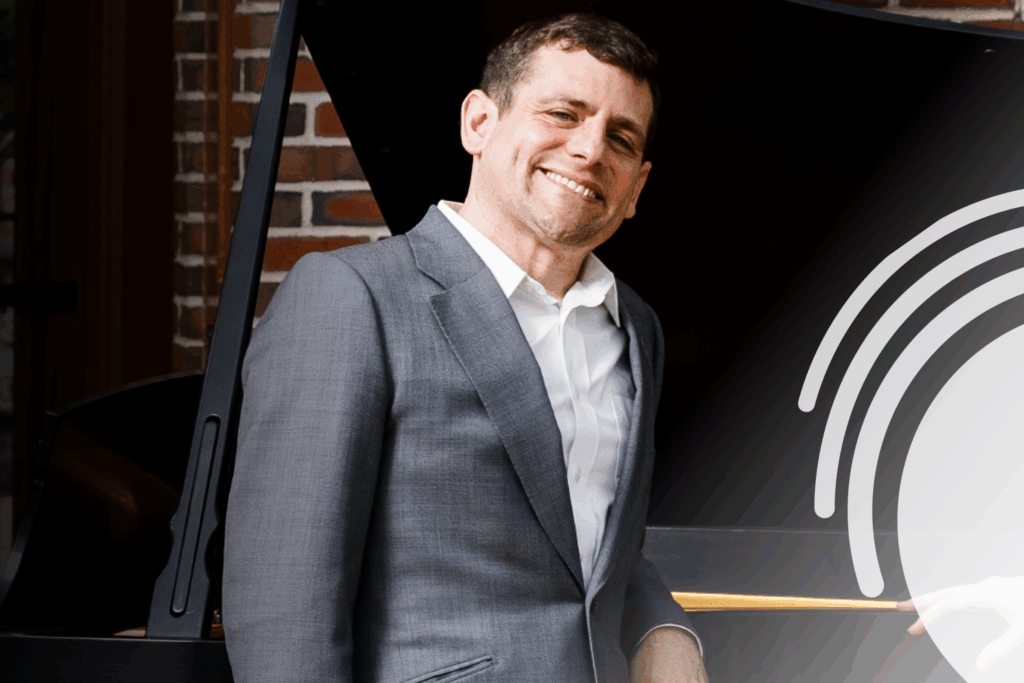 A picture of one of the musicians smiling.