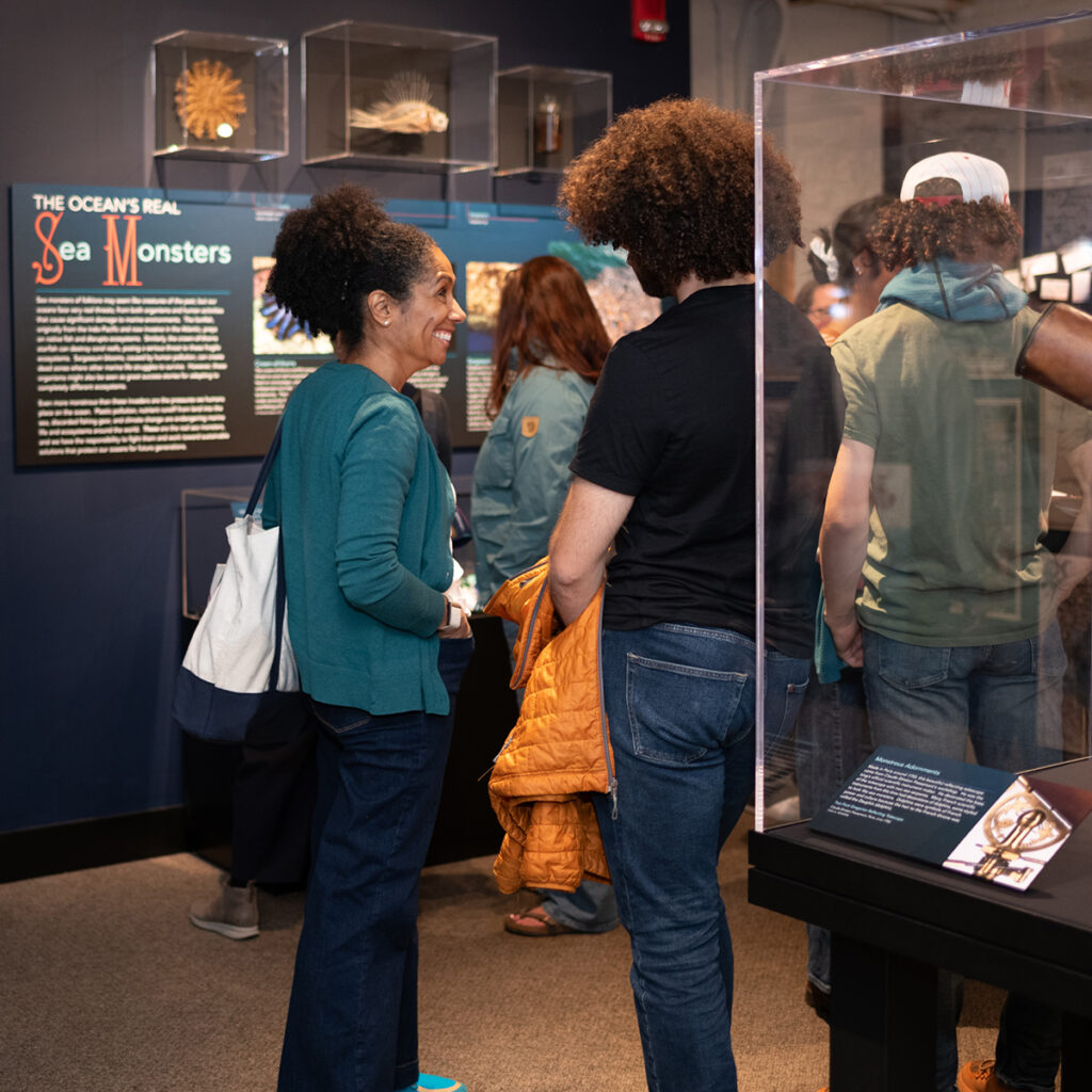 People chatting at a museum