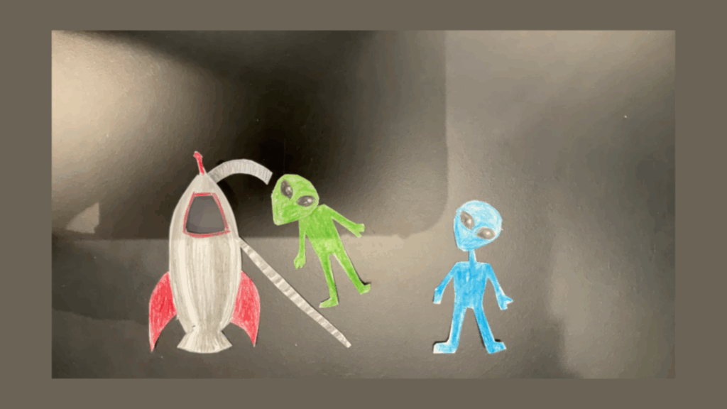 Image of a spaceship and aliens